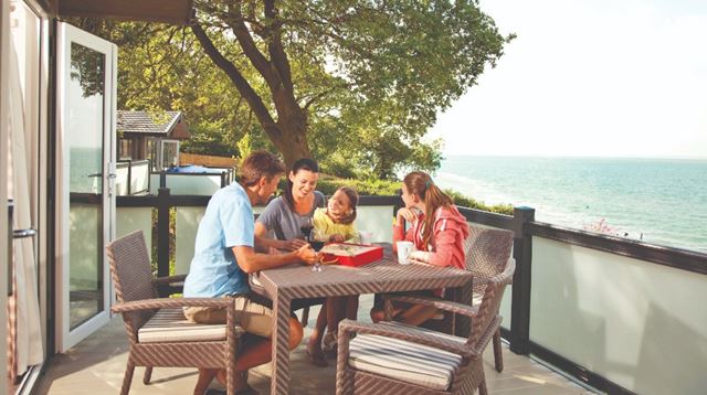 Family playing a board game outside
